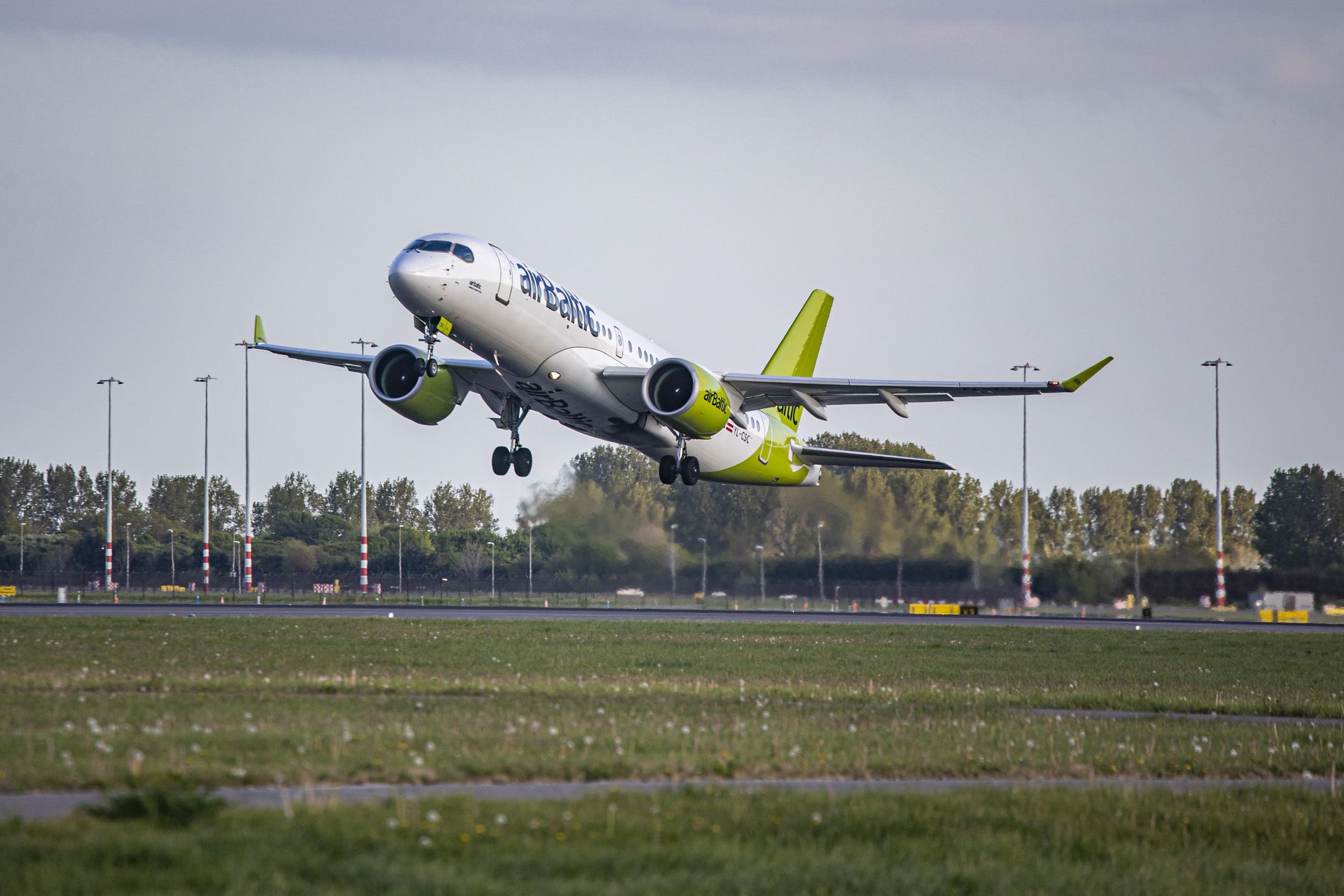 Air Baltic Airbus A220-300 the former Bombardier CSeries CS300 BD-500 aircraft as seen departing from Amsterdam Schiphol Airport. The taking-off airplane has the registration YL-CSC and the name Aluksne. airBaltic is the flag carrier of Latvia and connects Amsterdam to Riga, Tallinn, Tampere and Vilnius. The passenger traffic began rising showing significant improvement after 2 years of lockdown measures and travel restrictions due to the COVID-19 Coronavirus Pandemic. Amsterdam, the Netherlands on April 27, 2022 (Photo by Nicolas Economou/NurPhoto via Getty Images)