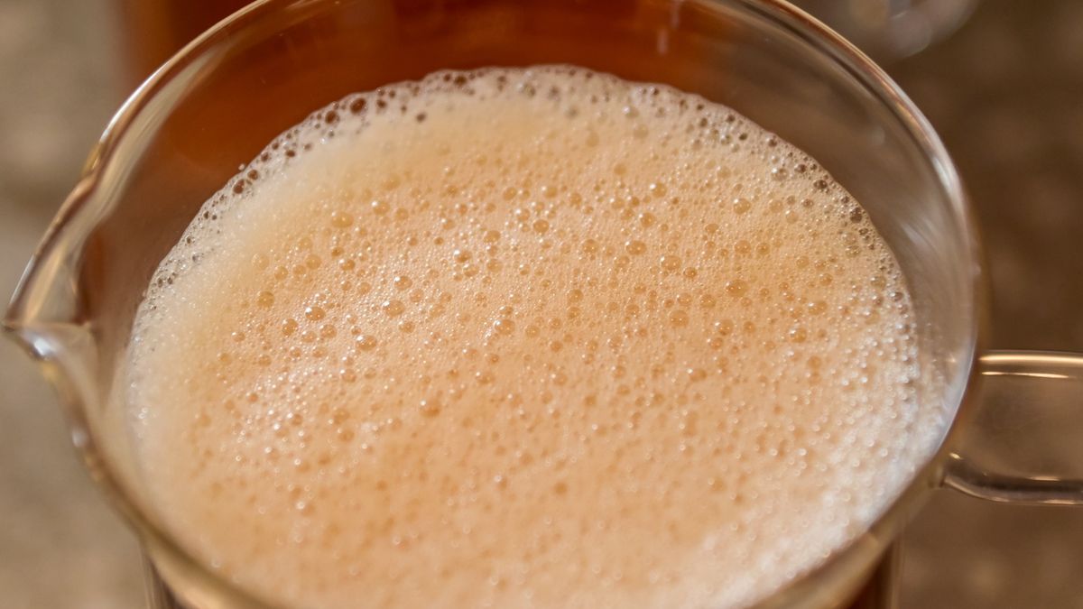 High angle view of the cold black tea with tiny bubbles on the surfaceHigh angle view of the cold black tea with tiny bubbles on the surface. Food and drink.hhhooohigh angle shot, high angle of view, liquor, nobody, lifestyle, iced tea, cuisine