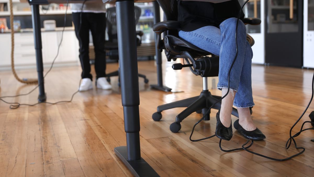 SAN FRANCISCO, CALIFORNIA - MARCH 24: Employees at tech startup company Fast work at their desks in the office on March 24, 2021 in San Francisco, California. A limited number of employees at a tech company in San Francisco returned to work in the office as San Francisco and 5 other California counties moved into the orange tier of reopening. The orange tier allows non-essential offices to open at 25% capacity. (Photo by Justin Sullivan/Getty Images)