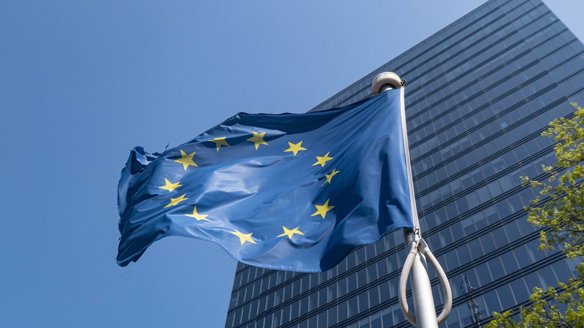Flag of Europe on flagpole waving in the blue sky on a sunny day among the high buildings in the European capital city Brussels near Brussels North Railway station. The flag of Europe or the European Flag is the symbol of the Council of Europe CoE and The European Union EU as seen in the Belgian capital Brussel. Brussels, Belgium on April 24, 2022 (Photo by Nicolas Economou/NurPhoto via Getty Images)