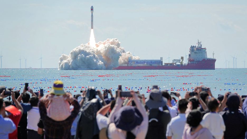 HAIYANG, CHINA - SEPTEMBER 24, 2024 - Spectators watch the launch of Jielong No.3 carrier rocket from the seaside in Haiyang city, Shandong province, China, Sept 24, 2024. (Photo credit should read CFOTO/Future Publishing via Getty Images)