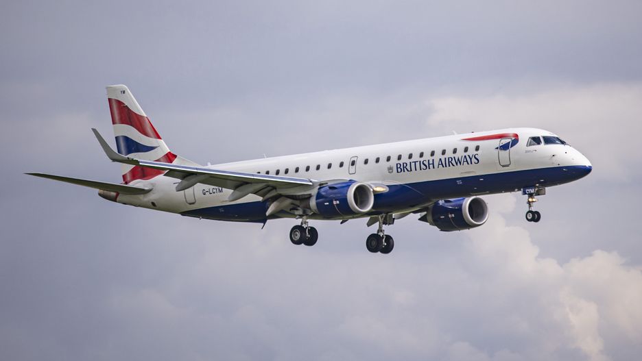 British Airways Embraer ERJ-190 ( ERJ-190-100 SR or ERJ-190SR ) aircraft as seen flying and landing at Amsterdam Schiphol Airport. The narrow-body airplane has the registration G-LCYM and is operated by BA CityFlyer connecting the Dutch capital to London City Airport. British Airways BA is the flag carrier of the United Kingdom, headquartered in London with the main hub Heathrow Airport. It is the seconds largest UK airline carrier part of IAG International Airlines Group and member of Oneworld aviation alliance. Many European airports suffered from flight delays and cancellations because of the staff shortage wave and the strikes during the busy summer travel season with increased demand for air travel, a recovery for the aviation industry, tour operators and airlines after the Covid-19 Coronavirus pandemic. Amsterdam, the Netherlands on June 2022 (Photo by Nicolas Economou/NurPhoto via Getty Images)