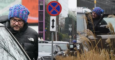 Opatulony w zimową czapkę Tomasz Karolak PARKUJE NA ZAKAZIE, po czym pędzi załatwiać sprawunki (ZDJĘCIA)