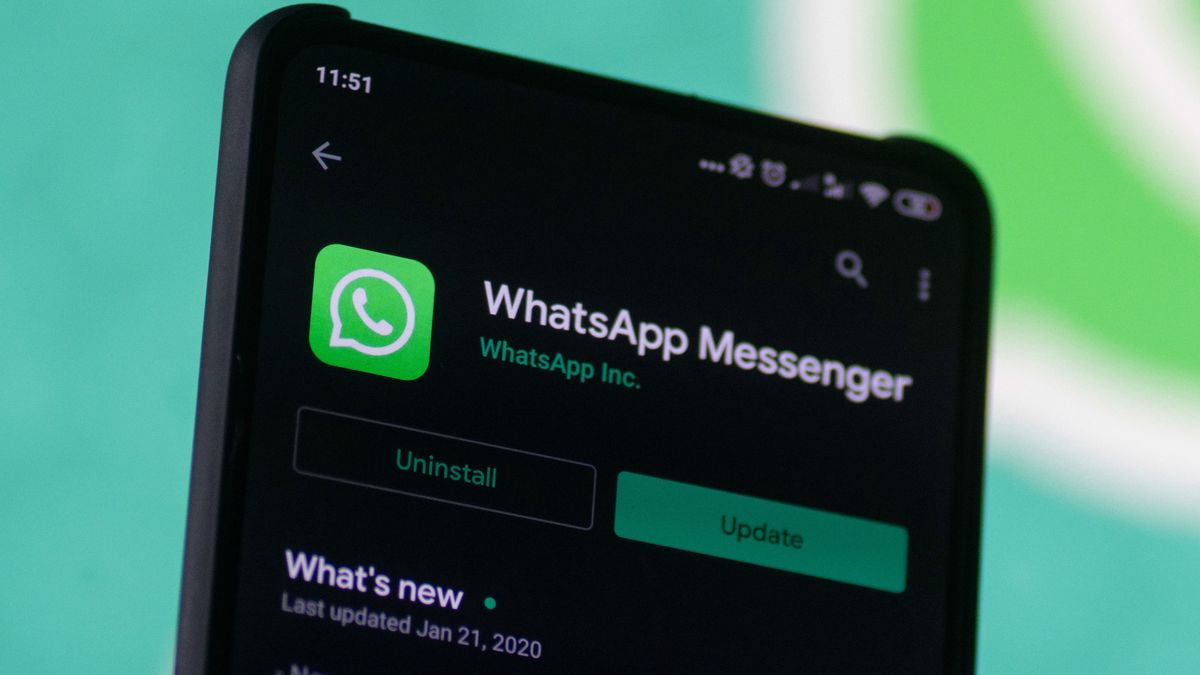 WhatsApp logo displayed on a phone screen, smartphone and keyboard are seen in this multiple exposure illustration. WhatsApp Messenger is a multiplatform mobile application that provides an encrypted instant messaging system belonging to Facebook, photo taken in Amsterdam, Netherlands on January 28, 2020 (Photo illustration by Nicolas Economou/NurPhoto via Getty Images)
