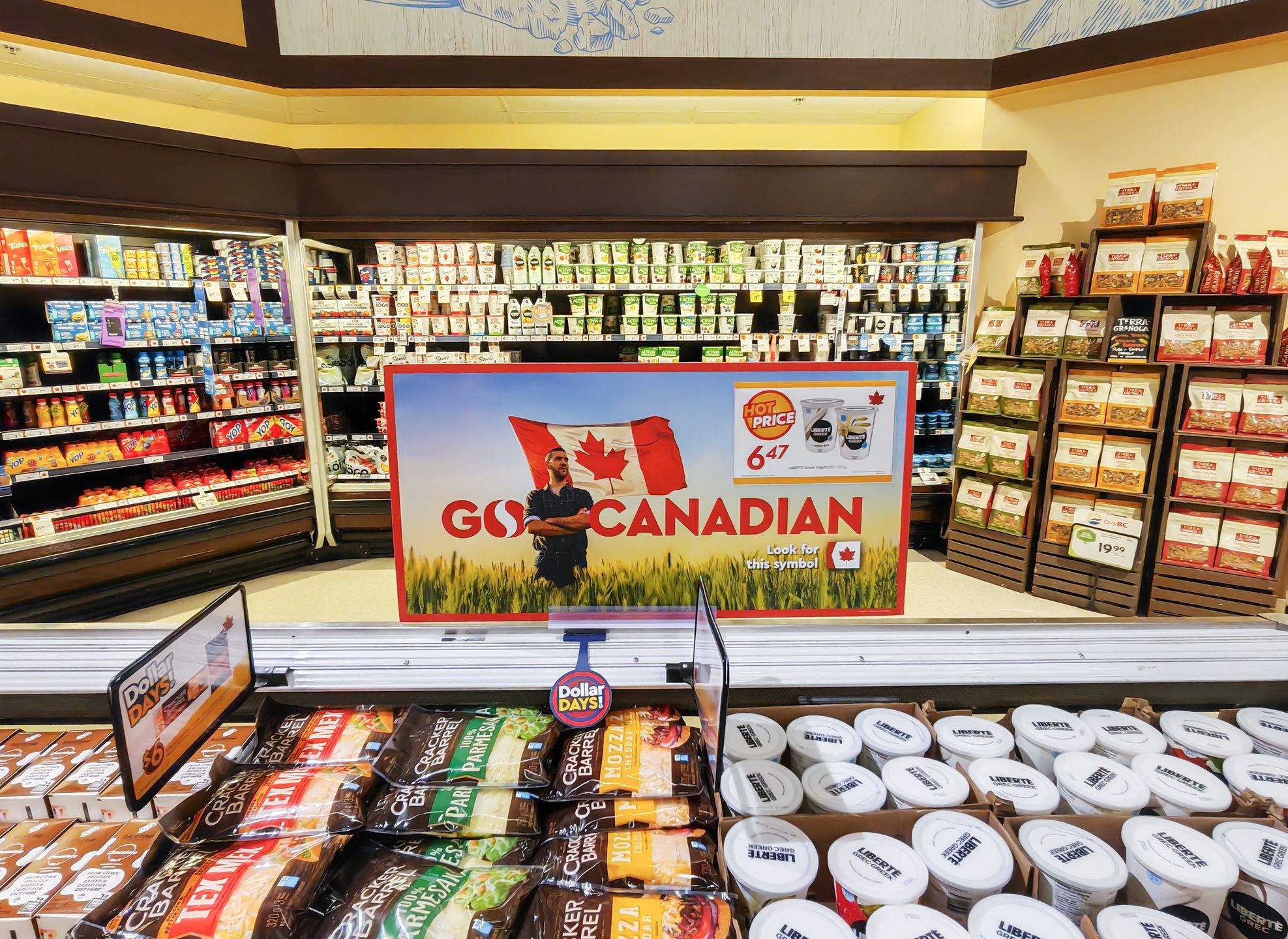 VANCOUVER, CANADA - MARCH 28: Products on the shelves are labelled with the Canadian flag tags at a supermarket on March 28, 2025 in Vancouver, Canada. In response to US President Donald Trump's tariff threats, Canadians  have adopted a "Buy Canada" approach, choosing domestic goods over American ones and canceling trips south of the border. (Photo by VCG/VCG via Getty Images)