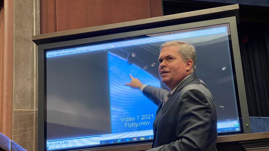 Deputy Director of U.S. Naval Intelligence Scott Bray points to a video of a 'flyby' as he testifies before a House Intelligence Counterterrorism, Counterintelligence, and Counterproliferation Subcommittee hearing about "Unidentified Aerial Phenomena,"  in the first open congressional hearing on 'UFOs' in more than half-century, on Capitol Hill in Washington, U.S., May 17, 2022.