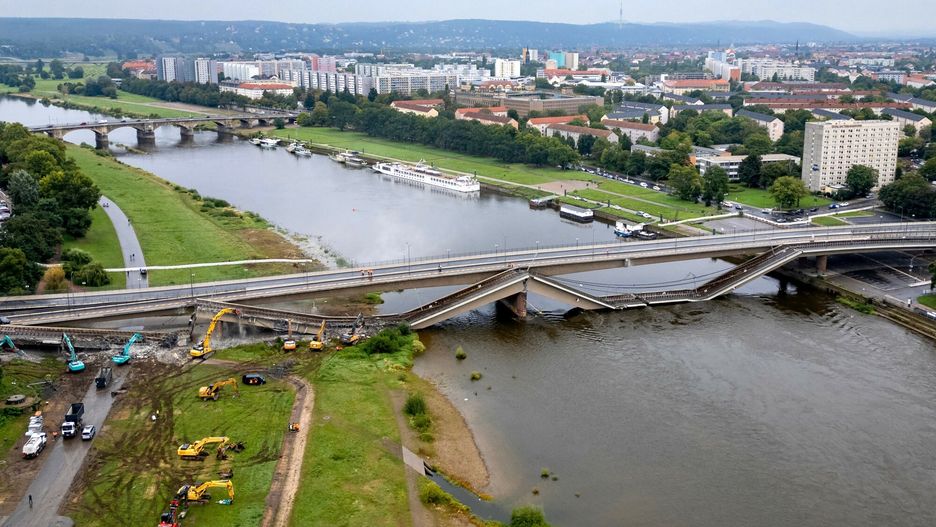 Temporary
Aerial view of the partially collapsed Carola Bridge (Carolabruecke) is seen in the city centre of Dresden, Saxony, eastern Germany, on September 13, 2024. A roughly 100-metre (330-foot) section of the Carola Bridge, which connects Dresden's historic old town to other parts of the city, plunged into the Elbe River around 03:00 am (0100 GMT) on September 11, 2024, the Dresden fire brigade said. Authorities said no one was injured but there was a risk of further sections crumbling. (Photo by Odd ANDERSEN / AFP)
ODD ANDERSEN