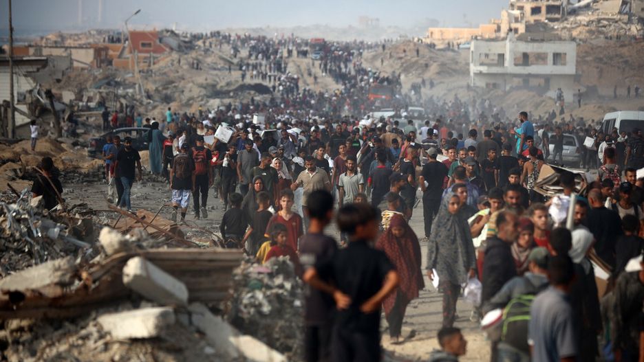 Gehenna Gazy
People carry aid packages along al-Rashid Street in western Jabalia, in the northern Gaza Strip, on June 22, 2025, after humanitarian aid trucks reportedly enter through the Israeli-controlled Zikim border crossing amid the ongoing war between Israel and Hamas. (Photo by Majdi Fathi/NurPhoto) (Photo by MAJDI FATHI / NurPhoto via AFP)
MAJDI FATHI