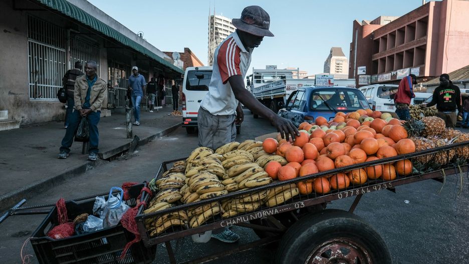 arch31
An informal worker sells produce in Harare's CBD on Thursday August 2, 2018, one day after post election protests and violence that saw the deaths of 6 protestors at the hands of the Zimbabwean military.  Informal workers who usually fill the sidewalks and market places of the CBD are largely absent from the streets of the city center for fear of harassment, expulsion and confiscation of their goods.  This is the first national election since former President Robert Mugabe stepped down as President of Zimbabwe on November 21, 2017 after a military take over 6 days prior that ended 37 years of rule.
Jemal Countess/Redux