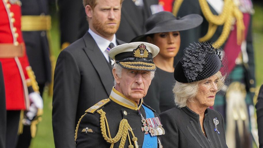 TemporaryPrince Andrew, from right, Princess Beatrice, Camilla, the Queen Consort, Britain's King Charles III, Meghan, Duchess of Sussex, Prince Harry and Prince William watch as the coffin of Queen Elizabeth II is placed into the hearse following the state funeral service in Westminster Abbey in central London Monday Sept. 19, 2022. The Queen, who died aged 96 on Sept. 8, will be buried at Windsor alongside her late husband, Prince Philip, who died last year. (AP Photo/Martin Meissner, Pool)Martin Meissner