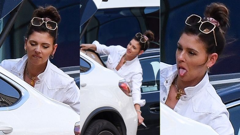 Klaudia Halejcio stroi miny, pakując obraz do samochodu