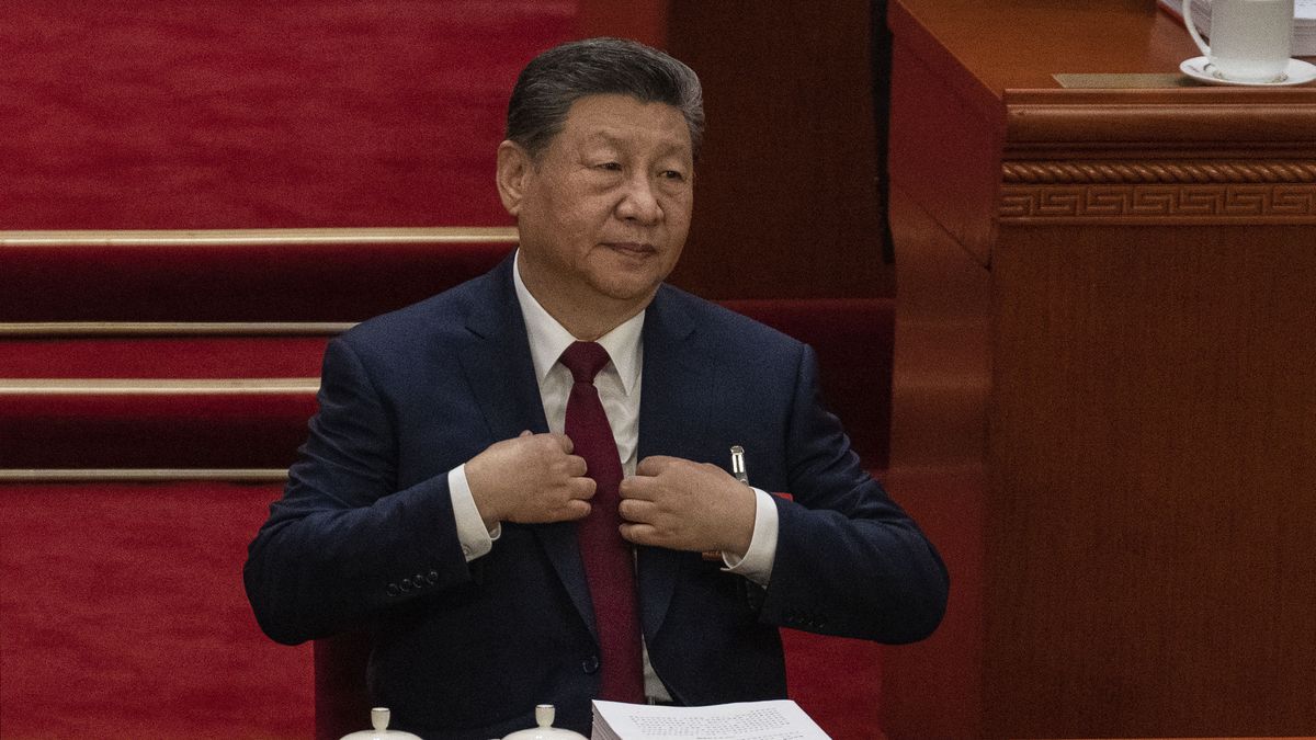 BEIJING, CHINA - MARCH 5: Chinese President Xi Jinping adjusts his jacket as he attends the opening session of the National People's Congress at the Great Hall of the People on March 5, 2026 in Beijing, China. China's annual political gatherings, which includes the important National People's Congress (NPC), and is known as the Two Sessions, convenes leaders and lawmakers to set the government's agenda for domestic economic and social development for the year. The meetings are expected to close by March 12th. (Photo by Kevin Frayer/Getty Images)
