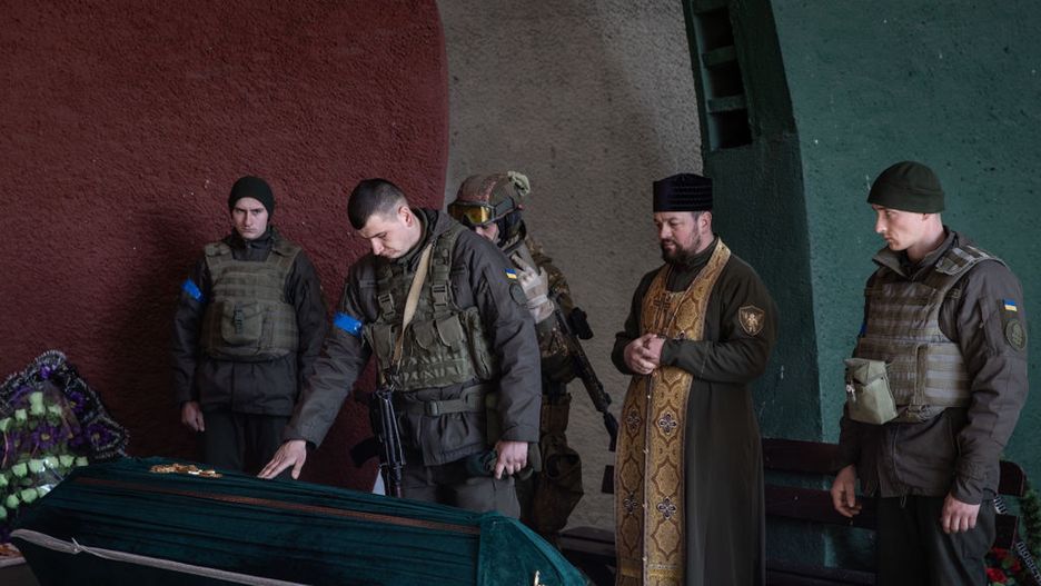 Kyiv Braces For Renewed Russian AssaultKYIV, UKRAINE - MARCH 15:  Members of the Ukrainian military pay tribute to Ukrainian soldier, Roman who was killed in recent fighting on the outskirts of Kyiv during his funeral service on March 15, 2022 in Kyiv, Ukraine. Russian forces continue to attempt to encircle the Ukrainian capital, although they have faced stiff resistance and logistical challenges since launching a large-scale invasion of Ukraine last month. Russian troops are advancing from the northwest and northeast of the city. (Photo by Chris McGrath/Getty Images)Chris McGrath