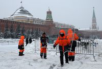 MOSCOW, RUSSIA - JANUARY 14: Municipal workers carry a metal picket fence against the backdrop of the Kremlin during snow removal, on January 14, 2025, in Moscow, Russia. (Photo by Contributor/Getty Images)