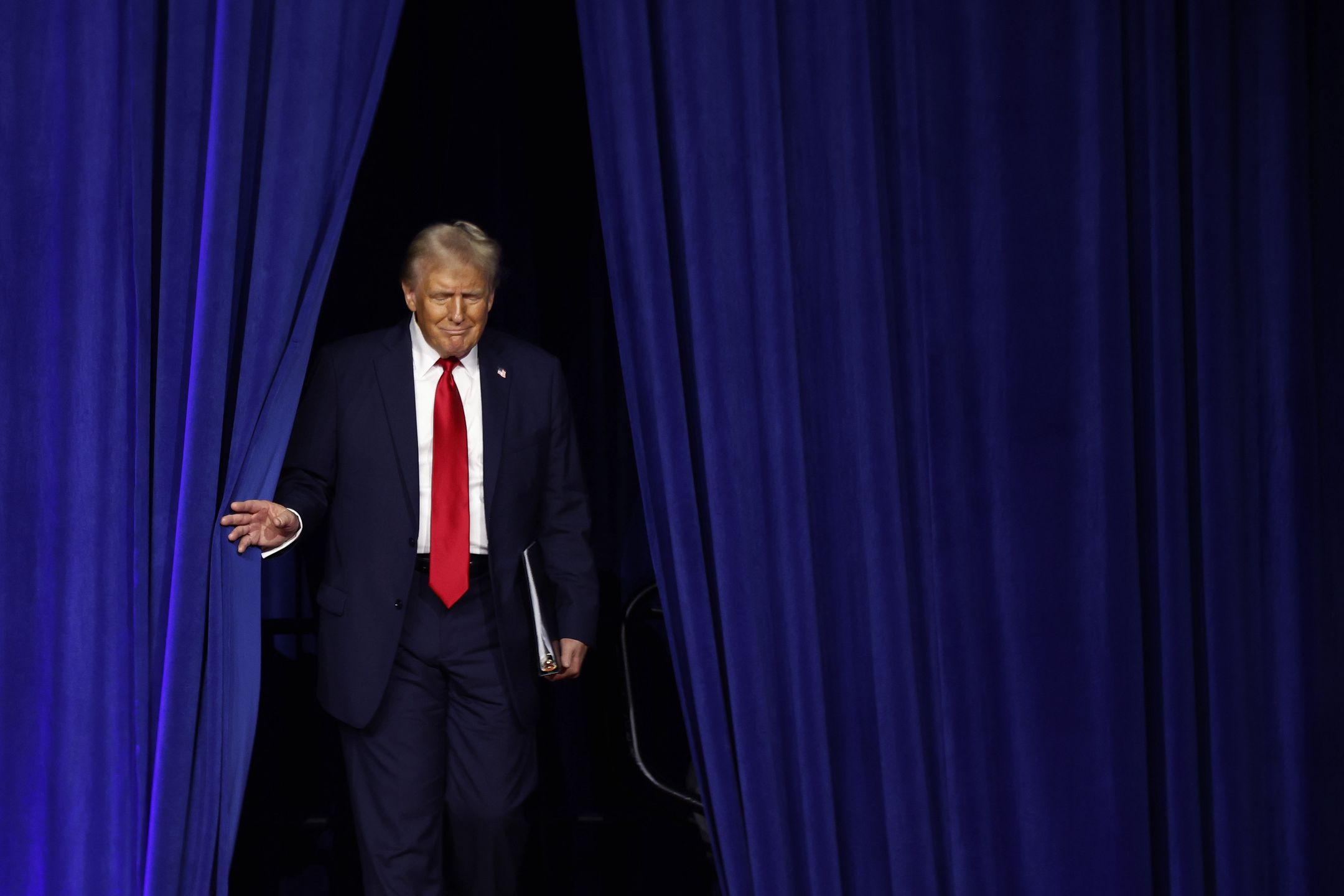WEST PALM BEACH, FLORIDA - NOVEMBER 05: Republican presidential nominee, former U.S. President Donald Trump arrives to speak during an election night event at the Palm Beach Convention Center on November 06, 2024 in West Palm Beach, Florida. Americans cast their ballots today in the presidential race between Republican nominee former President Donald Trump and Vice President Kamala Harris, as well as multiple state elections that will determine the balance of power in Congress. (Photo by Chip Somodevilla/Getty Images)