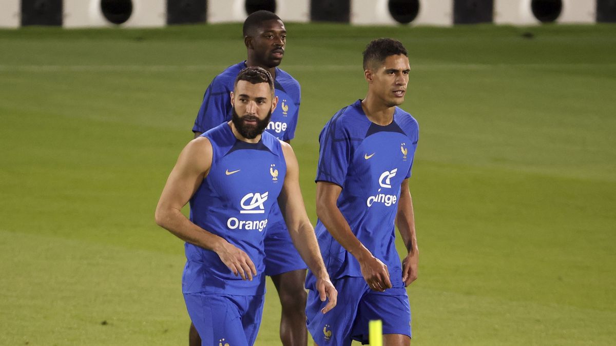 DOHA, QATAR - NOVEMBER 19: Karim Benzema, Raphael Varane, behind Ousmane Dembele of France during Team France practice ahead of the FIFA World Cup Qatar 2022 at Al Sadd SC Stadium on November 19, 2022 in Doha, Qatar. (Photo by Jean Catuffe/Getty Images)