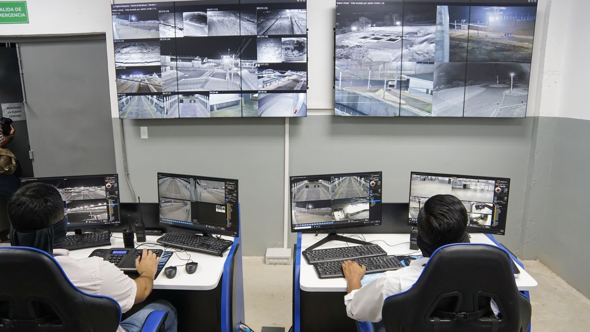 SAN VICENTE, EL SALVADOR - FEBRUARY 02: Correctional officers observe screens in the monitoring center during the inauguration of the new maximum security prison for the Confinement of Terrorism (CECOT) in the municipality of Tecoluca, in San Vicente, El Salvador, on February 2, 2023. The authorities of El Salvador opened the Confinement Center against Terrorism (CECOT), a maximum security mega prison created to house up to 40,000 inmates who already saturate the prison system of the Central American country. Since March 2022, when President Nayib Bukele announced the state of emergency, more than 62,000 suspected gang members have been detained. (Photo by Alex Pena/Anadolu Agency via Getty Images)