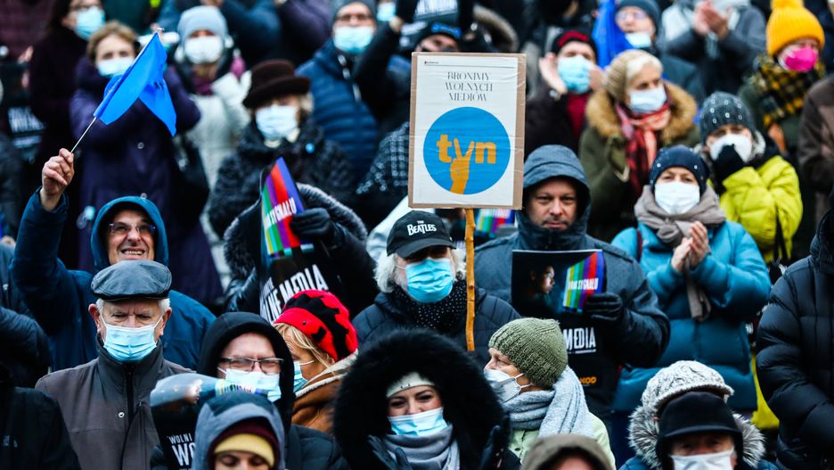 People attend 'Free People, Free Media' protest at the Main Square in Krakow, Poland on December 19, 2021. Protesters gathered after Poland's parliament, controlled by Law and Justice(PiS) party, voted unexpectedly in support of a controversial media reform bill targeting Discovery-owned TVN group channels. The bill now goes to President Andrzej Duda to be signed into law. (Photo by Beata Zawrzel/NurPhoto via Getty Images)