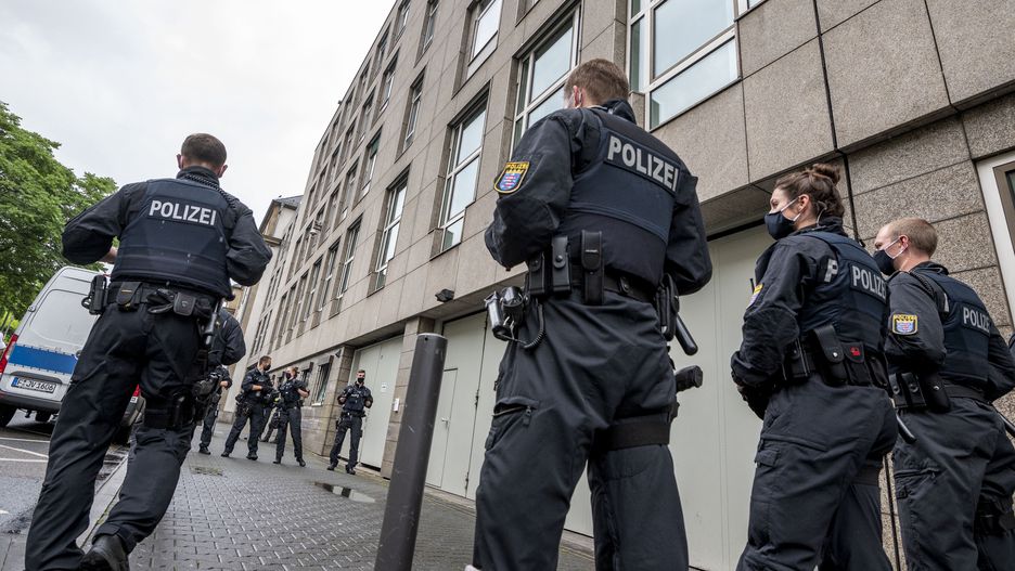 FRANKFURT AM MAIN, GERMANY - JUNE 16: Police officers wait for the departure of Stefan Ernst, who is accused of murdering politician Walter Luebcke, and Walter H. after the first day of the trial at the Oberlandgericht Frankfurt courthouse on June 16, 2020 in Frankfurt, Germany. Ernst, who has a history of right-wing extremism, is accused of shooting Luebcke, a politician of the German Christian Democrats (CDU) in the state of Hesse who had been outspoken in his support of refugees, in the head while Luebcke sat on the terrace of his home on June 2, 2019. Co-defendant Markus H. is accused of aiding and abetting the crime.  (Photo by Thomas Lohnes/Getty Images)