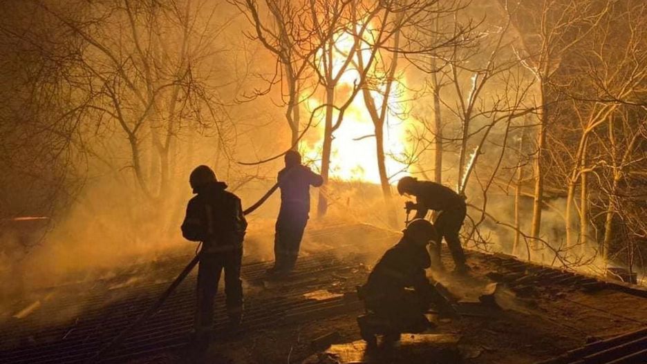 TemporaryThis handout picture taken on March 22, 2022 and released on March 23, 2022 by the Ukrainian State Emergency Service shows firefighters putting out a fire after Russian shelling on a warehouse in Mykolaiv. (Photo by Handout / Ukrainian State Emergency Service / AFP)HANDOUT