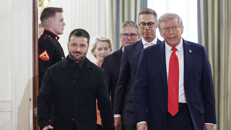 WASHINGTON, AUGUST 18: President Donald Trump walks with Ukraine President Volodymyr Zelensky, fellow European Leaders, into the Cross Hall before taking a group photo on August 18, 2025 at The White House in Washington. Leaders of Ukraine, France, United Kingdom, Germany, Italy, and Finland were present to discuss the future of the war in Ukraine. (Photo by Tom Brenner for The Washington Post via Getty Images)
