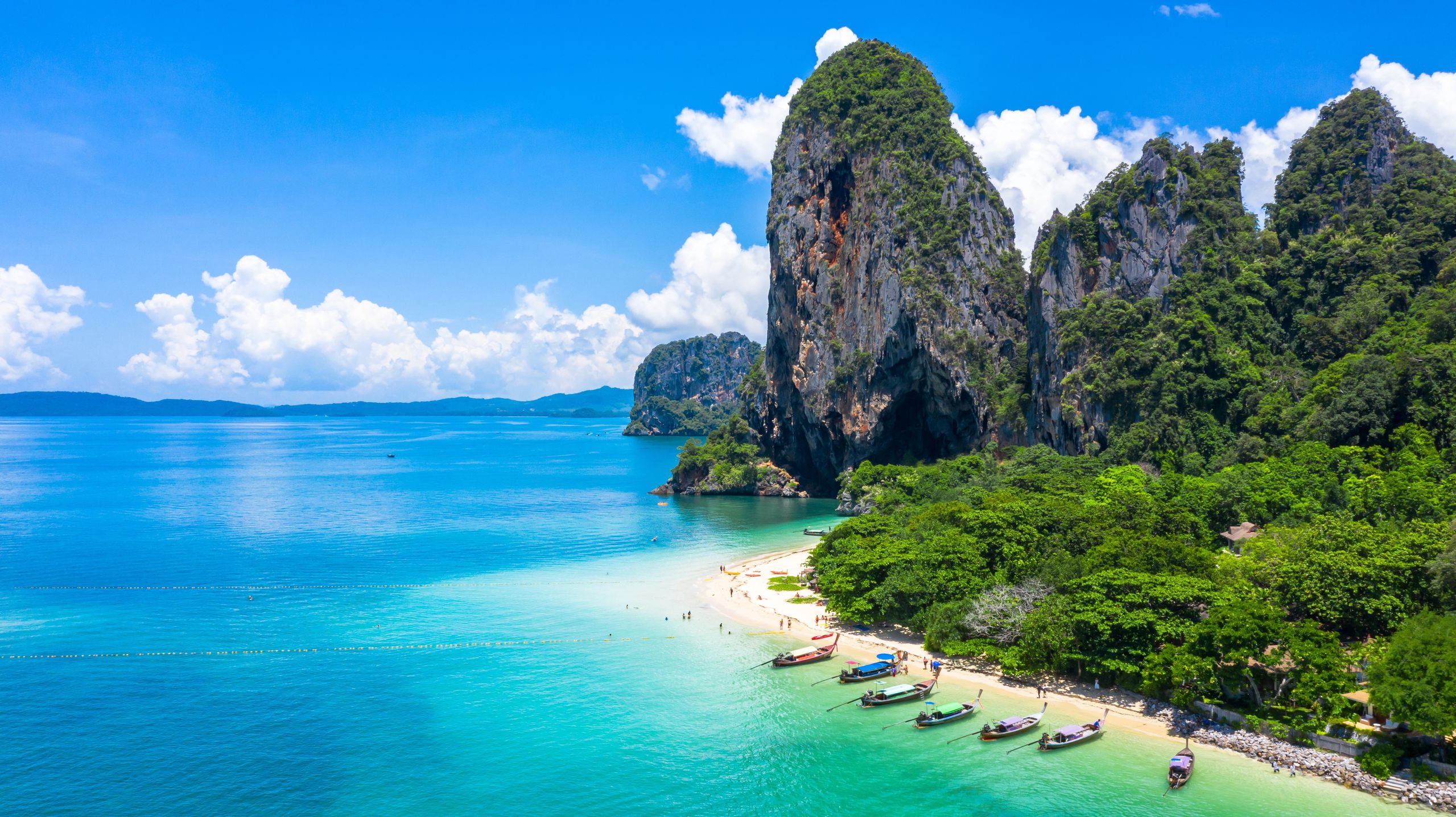 Aerial view Phra Nang Cave Beach with traditional long tail boat on Ao Phra Nang Beach, Railay Bay, Krabi, Thailand.aerial, aerial view, andaman, ao nang, asia, bay, beach, beautiful, blue, boat, cave, clear, cliff, climbing, coast, coastline, coral, destination, exotic, island, krabi, lagoon, long, longtail, nang, nature, ocean, paradise, phra, phra nang, railay, relax, rock, sand, sea, seascape, shore, sky, summer, tail, thai, thailand, tourism, traditional, travel, trip, tropical, turquoise, vacation, water