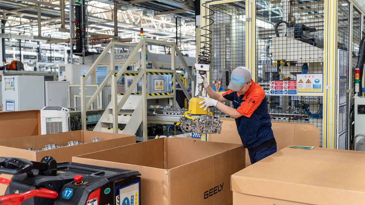 YIWU, CHINA - JUNE 17: A technician puts components of M252 engine into a box at the workshop of Zhejiang Yili Automobile Components Co., Ltd. on June 17, 2025 in Yiwu, Zhejiang Province of China. The M252 engine, which was jointly developed by Geely Automobile and Mercedes-Benz, will be exported to Germany. (Photo by VCG/VCG via Getty Images)