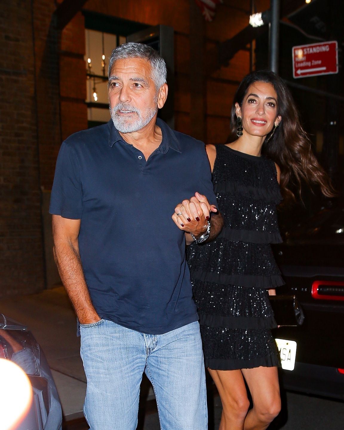 George Clooney and Amal Clooney hold hands leaving The Greenwich Hotel in NYCNew York, NY  - George Clooney and Amal Clooney hold hands leaving The Greenwich Hotel in New York City after dinner at Locanda Verde.*UK Clients - Pictures Containing ChildrenPlease Pixelate Face Prior To Publication*,Image: 725419976, License: Rights-managed, Restrictions: , Model Release: no, Pictured: George Clooney, Amal Clooney, Credit line: Fernando Ramales / BACKGRID / Backgrid USA / ForumFernando Ramales / BACKGRID / Backgrid USA / ForumGeorge Clooney, Amal Clooney, Couple, Holding Hands, Dinner, Actor, Fashion, Style, Cameras, Flashing Lights, Locanda Verde