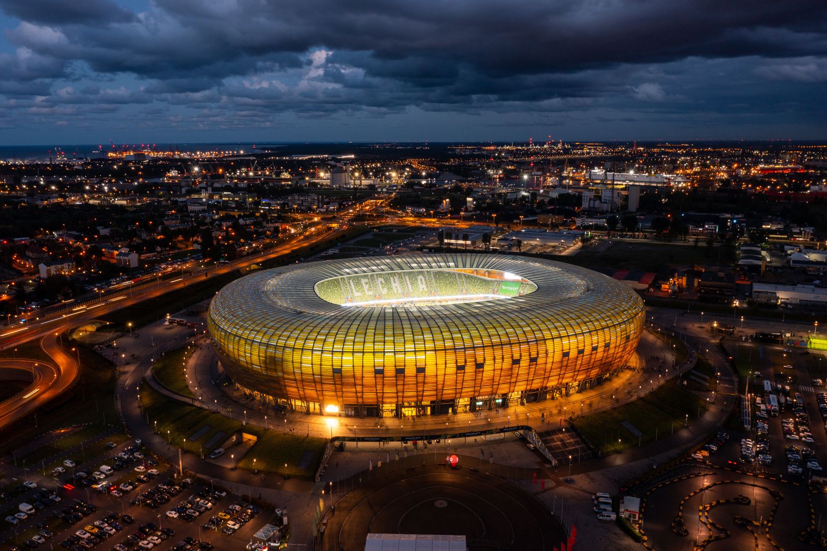 Gdansk, Poland - August 31, 2022: Aerial landscape with amber shape stadium - Polsat Plus Arena by the Baltic Sea in Gdansk at dusk, Poland.
stadium, gdansk, arena, polsat plus arena, aerial, amber, architecture, baltic, beautiful, blue, building, city, cityscape, construction, destination, drone, dusk, ekstraklasa, europe, european, exterior, facade, football, gold, highway, illuminated, landmark, landscape, league, lechia, modern, panorama, panoramic, poland, polish, road, scenery, seaside, shape, sky, soccer, sport, summer, sunset, team, tourism, travel, urban