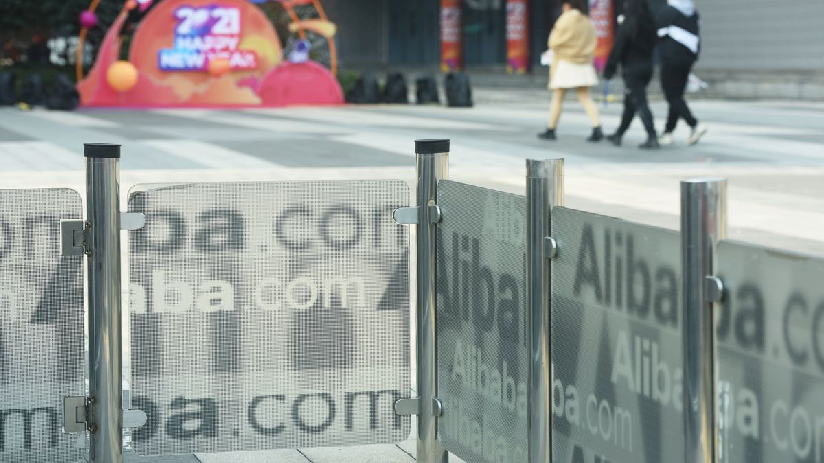 HANGZHOU, CHINA - DECEMBER 24: People walk by the Alibaba headquarters on December 24, 2020 in Hangzhou, Zhejiang Province of China. (Photo by Long Wei/VCG via Getty Images)