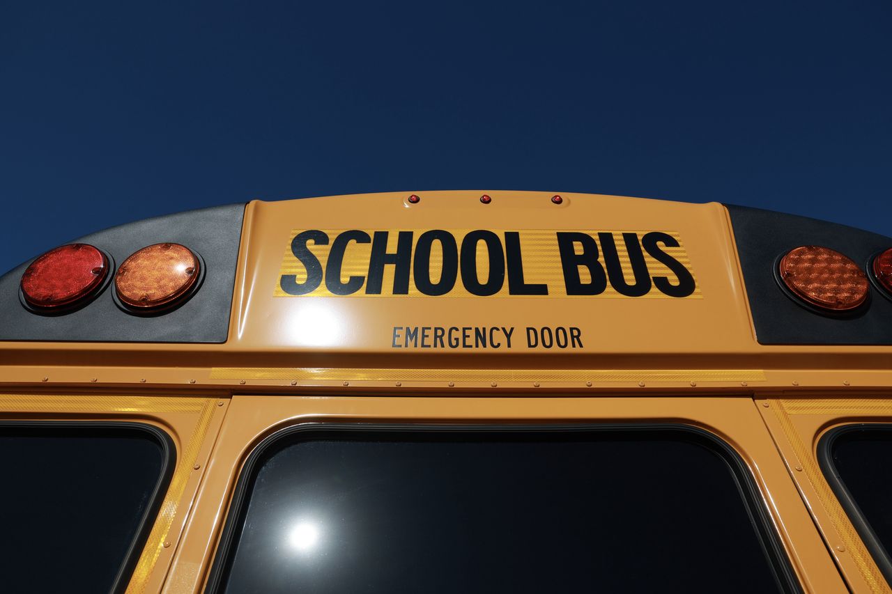 RICHMOND HEIGHTS, FLORIDA - MARCH 11: An electric bus is parked as U.S. Environmental Protection Agency Administrator Michael S. Regan visits during an event to highlight funding for electric school buses at the Coral Reef High School on March 11, 2024 in Richmond Heights, Florida. Miami-Dade County Public Schools received nearly $20 million to purchase 50 electric school buses as part of President Joe Biden’s Investing in America Agenda. The program is helping schools nationwide purchase over 2,700 clean school buses in 280 school districts serving over 7 million students across 37 states. (Photo by Joe Raedle/Getty Images)