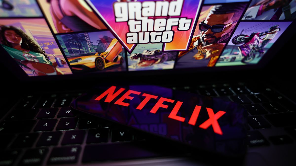 GTA IV website displayed on a laptop screen and Netflix logo displayed on a phone screen are seen in this illustration photo taken in Krakow, Poland on August 25, 2026. (Photo by Jakub Porzycki/NurPhoto via Getty Images)