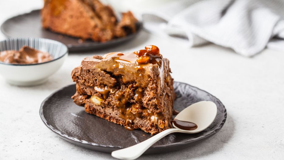 Piece of homemade chocolate cake with chocolate cream on a black saucer, white background.
background, birthday, black, brown, brownie, cake, caramel, cheesecake, chocolate, closeup, coffee, cream, dark, delicious, dessert, eating, food, fudge, homemade, layered, marble, nut, pastry, peanut, peanuts, pie, piece, plate, snack, snickers, spoon, sweet, tasty, toffee, vegan, white
