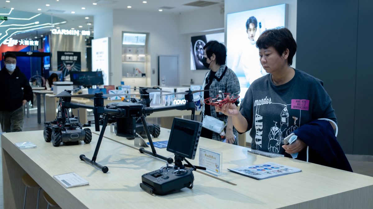 TIANJIN, CHINA - 2021/11/14: Customers in a DJI store.  DJI ( SZ DJI Technology Co.,Ltd.), founded in 2006 in Shenzhen of China,  is now the leader of the industry of UAV and aerial photography, occupying about 80% of the global market. (Photo by Zhang Peng/LightRocket via Getty Images)