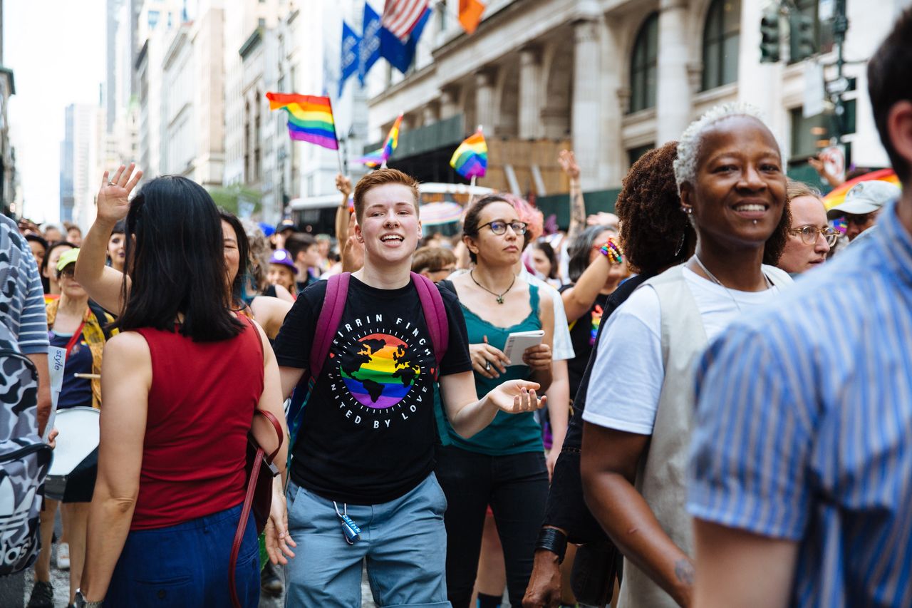 Marchers walk down 5th Avenue (Photo by Liz Devine/WWD/Penske Media via Getty Images)