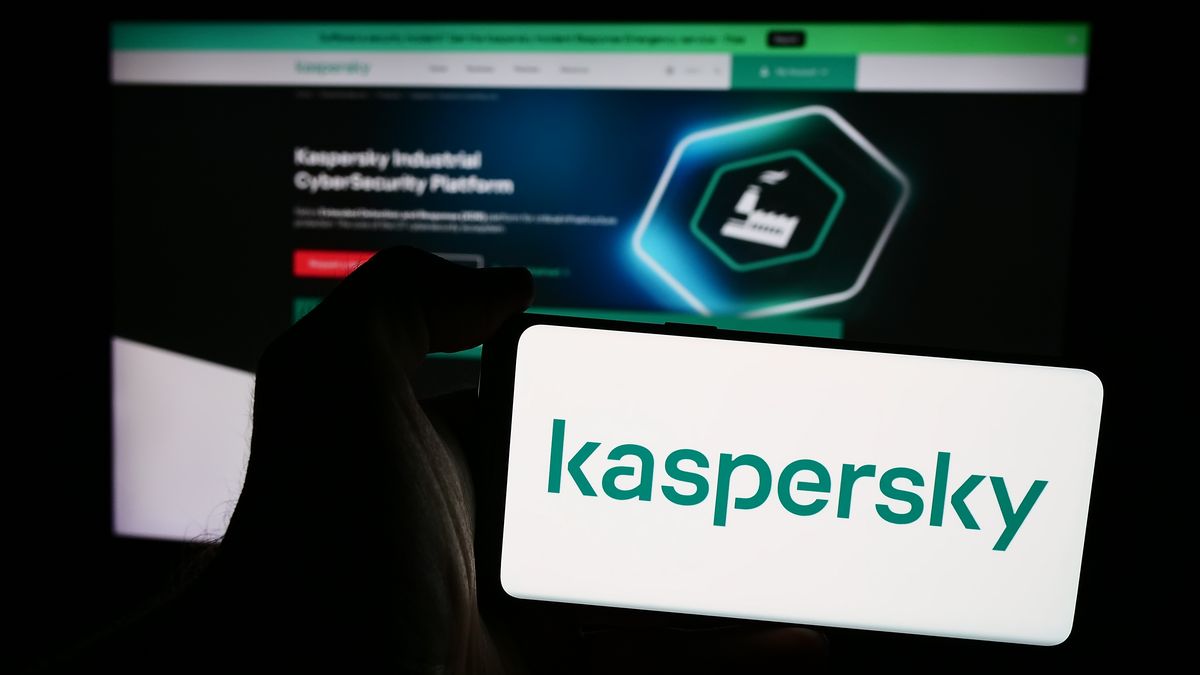 GERMANY - 2024/09/21: In this photo illustration, a person is holding a mobile phone with the logo of Russian cybersecurity company AO Kaspersky Lab in front of business webpage. (Photo Illustration by Timon Schneider/SOPA Images/LightRocket via Getty Images)