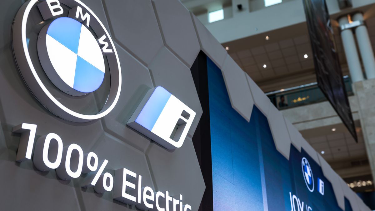 BMW's manufacturer logo is seen during the exhibition in Jakarta, Indonesia on November 1, 2023. The exhibition is dedicated to showcasing and promoting electric vehicles (EVs) powered by renewable energy sources. BMW is the leading premium brand in Indonesia in the first 6 months of 2023, registering a 28% increase over 2022. Furthermore, the BMW iX is also Indonesia's best-selling luxury Electric Vehicle. (Photo by Garry Lotulung/NurPhoto via Getty Images)