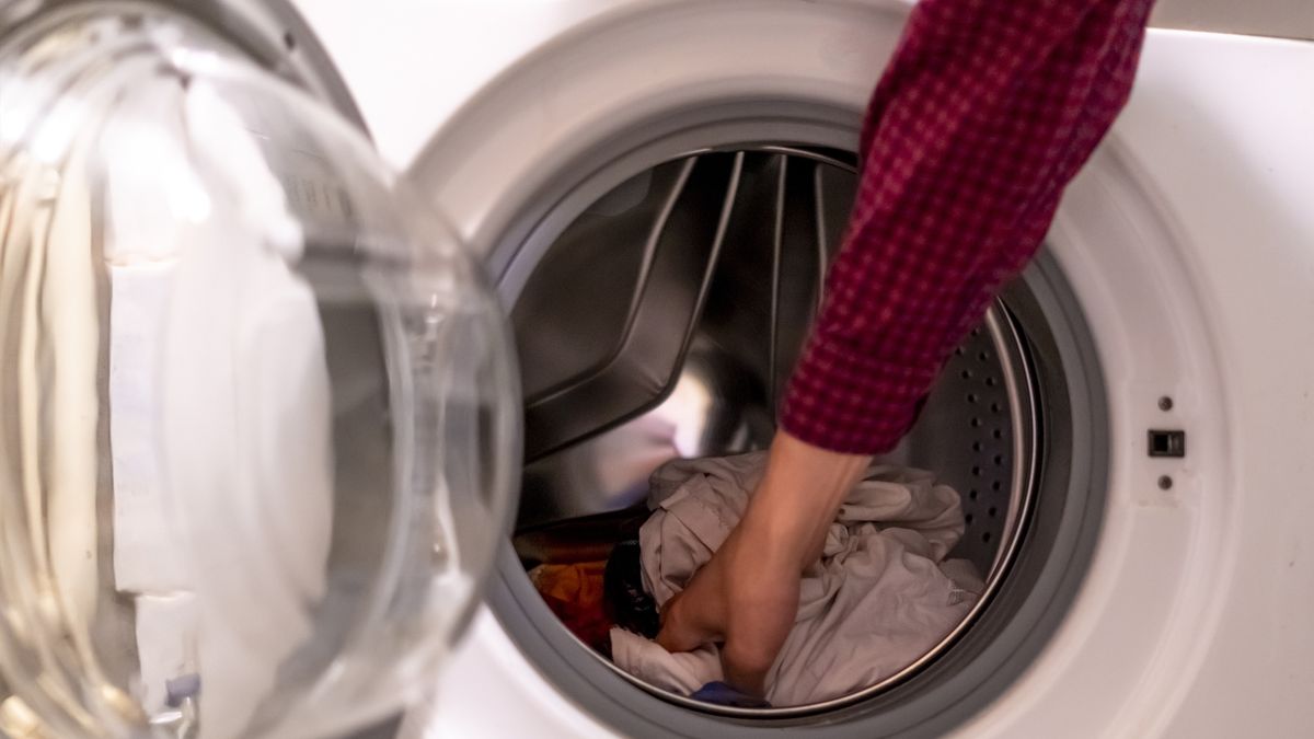 close up hands loading dirty clothes into washing machine at home bathroomclose up hands loading dirty clothes into washing machine at home bathroomlaundry, machine, washer, clothes, housework, appliance, household, hygiene, home, clothing, dirty, domestic, clean, wash, technology, female, white, equipment, loading, woman, one, person, door, holding, hand, open, chore, work, dryer, circle, house, cleaner, housekeeping, electrical, electronic, everyday, wet, background, washing, color, lifestyle, lady, indoors, load, towel, crouching, object, apparel, detail, basket, laundry, machine, washer, clothes, housework, appliance, household, hygiene, home, clothing, dirty, domestic, clean, wash, technology, female, white, equipment, loading, woman, one, person, door, holding, hand, open, chore, work, dryer, circle, house, cleaner, housekeeping, electrical, electronic, everyday, wet, background, washing, color, lifestyle, lady, indoors, load, towel, crouching, object, apparel, detail, basket