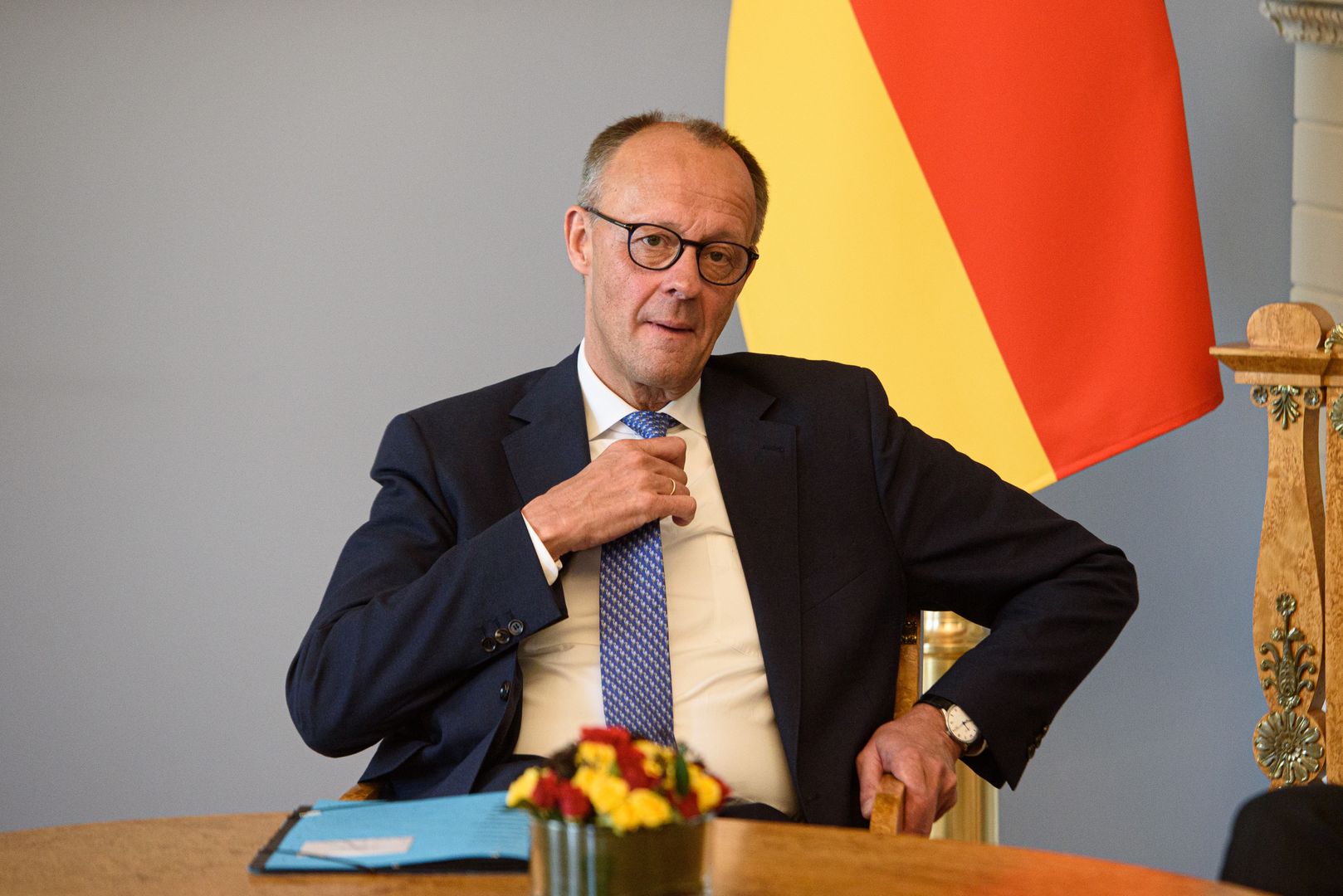 VILNIUS, LITHUANIA - 2025/05/22: German Chancellor Friedrich Merz adjusts his tie during the bilateral meeting at the Presidential Palace. German Federal Chancellor Friedrich Merz held a meeting with Lithuanian President Gitanas Nauseda at the Presidential Palace in Vilnius. His visit to Lithuania was timed to the formal inauguration of the German 45th Armored Brigade "Lithuania.". (Photo by Yauhen Yerchak/SOPA Images/LightRocket via Getty Images)