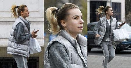 Izabela Janachowska pędzi ile sił w nogach wyposażonych w sneakersy za 3600 zł do swojego auta wartego ponad 2 miliony