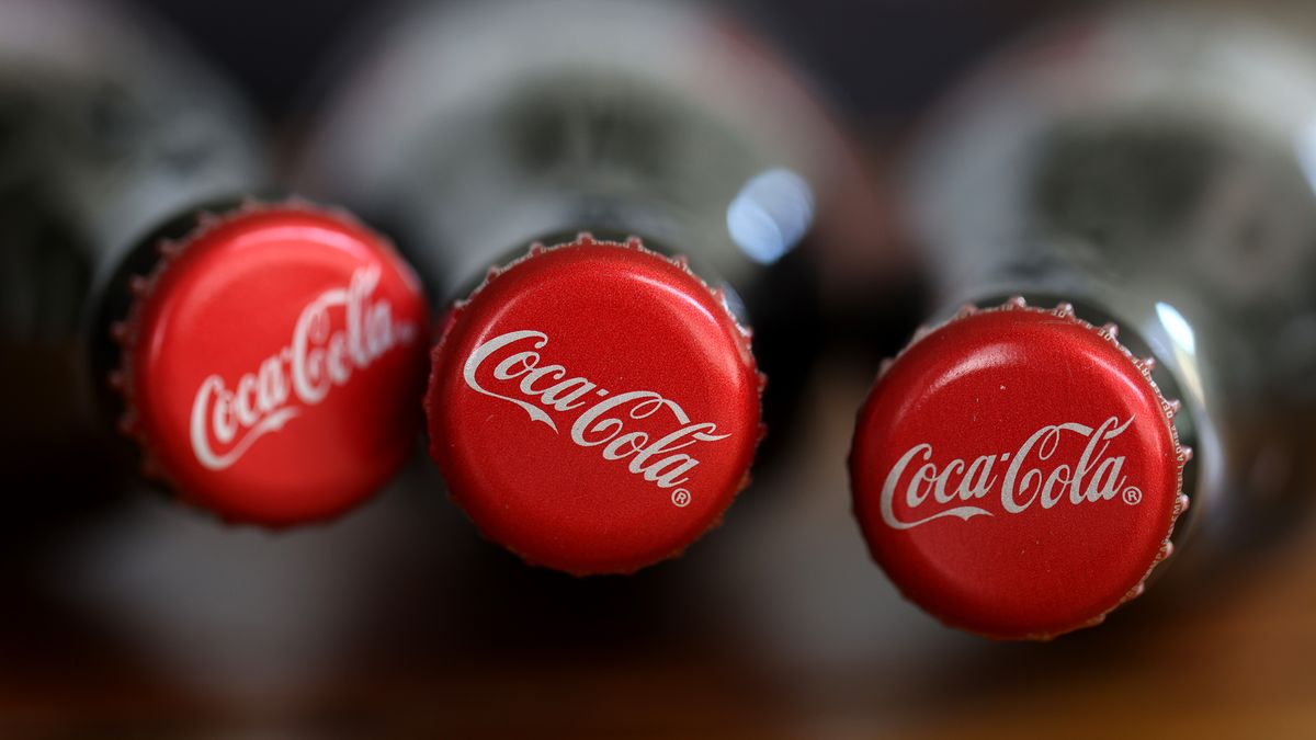 SAN ANSELMO, CALIFORNIA - APRIL 24: In this photo illustration, bottles of Coca Cola are displayed on April 24, 2023 in San Anselmo, California. Coca-Cola reported first-quarter earnings that beat analyst expectations with revenues of $10.96 billion compared to the expected $10.8 billion. (Photo Illustration by Justin Sullivan/Getty Images)