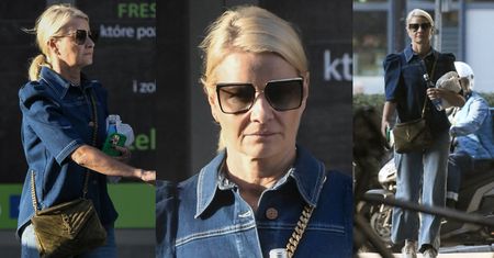Posępna Małgorzata Kożuchowska maszeruje z torebką za 12 TYSIĘCY do wartego PÓŁ MILIONA porsche (ZDJĘCIA)