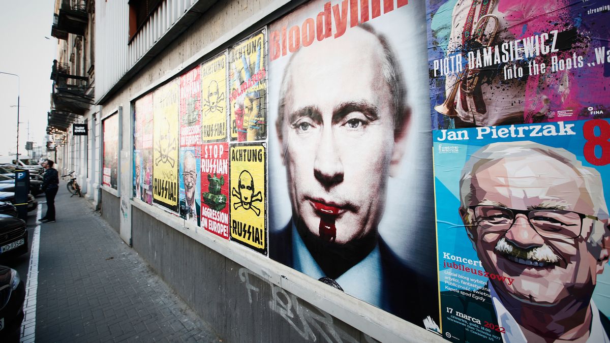 An anti-war poster with an image of Russian president Vladimir Putin is seen in central Warsaw, Poland on 23 March, 2022. (Photo by STR/NurPhoto via Getty Images)