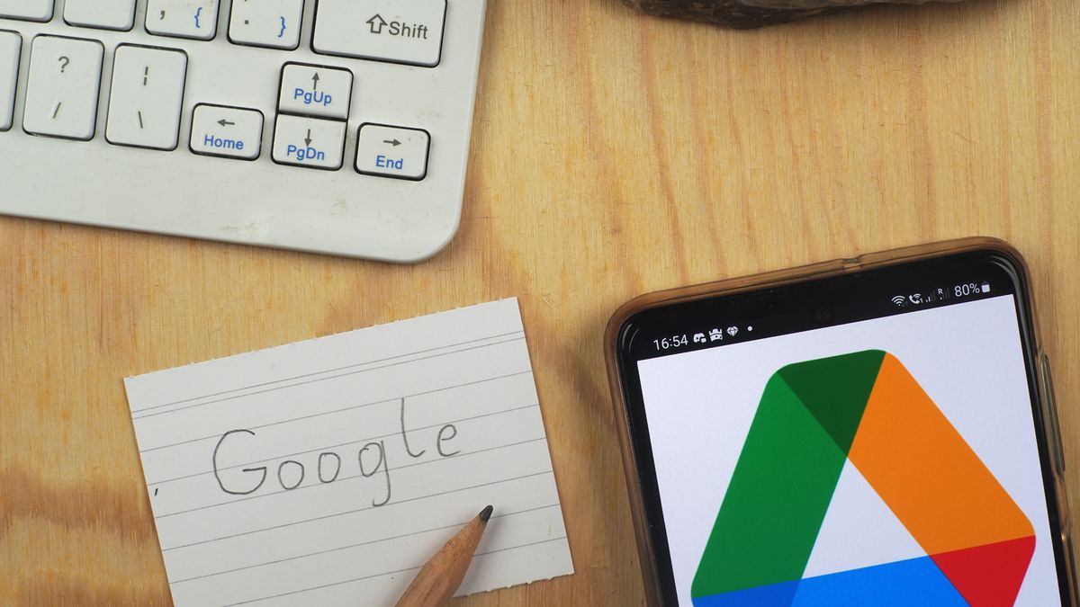 GERMANY - 2023/09/17: In this photo illustration, a Google Drive logo is seen displayed on a smartphone next to a Google inscription piece of paper. (Photo Illustration by Valera Golovniov/SOPA Images/LightRocket via Getty Images)