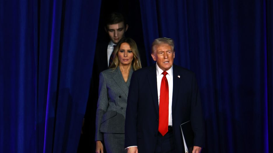 WEST PALM BEACH, FLORIDA - NOVEMBER 06:  Republican presidential nominee, former U.S. President Donald Trump arrives to speak with former first lady Melania Trump and Barron Trump during an election night event at the Palm Beach Convention Center on November 06, 2024 in West Palm Beach, Florida. Americans cast their ballots today in the presidential race between Republican nominee former President Donald Trump and Vice President Kamala Harris, as well as multiple state elections that will determine the balance of power in Congress.   (Photo by Joe Raedle/Getty Images)