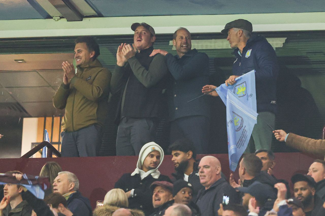 BIRMINGHAM, ENGLAND - OCTOBER 02: HRH William, Prince of Wales, celebrates Aston Villa's victory with Harry Aubrey-Fletcher (R), Edward van Cutsem (M-L), and Thomas van Straubenzee (L) - childhood friends of Prince William and godparents to his children - 
 on the final whistle during the UEFA Champions League 2024/25 League Phase MD2 match between Aston Villa FC and FC Bayern München at Villa Park on October 02, 2024 in Birmingham, England. (Photo by James Gill - Danehouse/Getty Images)