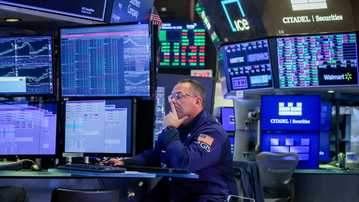 A trader works on the floor of the New York Stock Exchange (NYSE) in New York, US, on Monday, Nov. 10, 2025. Wall Street traders rushed to the riskiest corners of the market, with stocks climbing alongside Bitcoin as the US Senate advanced a plan to end the longest-ever government shutdown and remove a significant economic headwind. Photographer: Michael Nagle/Bloomberg via Getty Images