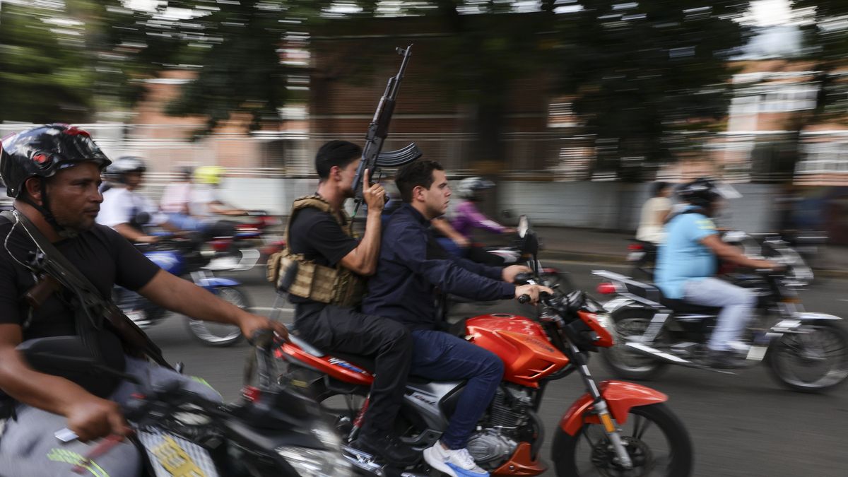 CARACAS, VENEZUELA - JANUARY 4: A caravan of armed men on motorcycles drives through the main streets of the city a day after the capture of Nicolas Maduro by US forces on January 4, 2026 in Caracas, Venezuela. US President Donald Trump announced on January 3 that his country's military had launched a large-scale attack on Venezuela and captured its President Nicolas Maduro and his wife, Cilia Flores. Venezuela faces a political and social crisis, while citizens start to struggle with the lack of supplies and water. (Photo by Jesus Vargas/Getty Images)