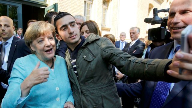Anas Modamani z Angelą Merkel