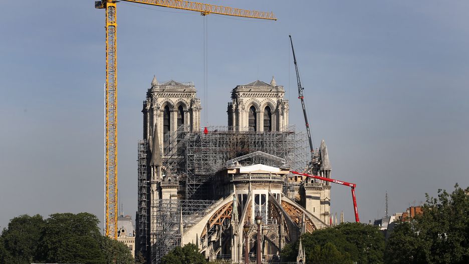 PARIS, FRANCE - MAY 07: Giant cranes are seen near the Notre Dame Cathedral on May 07, 2020 in Paris, France. Almost one year after fire ravaged the emblematic monument, restoration work has resumed slowly after an interruption due to the lockdown imposed to slow the rate of the coronavirus disease (COVID-19). The Coronavirus (COVID-19) pandemic has spread to many countries across the world, claiming over 266,000 lives and infecting over 3.8 million people. (Photo by Chesnot/Getty Images)